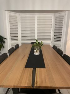 Plantation Shutters Over Dining Table — Elegant Blinds Awnings in Forster, NSW
